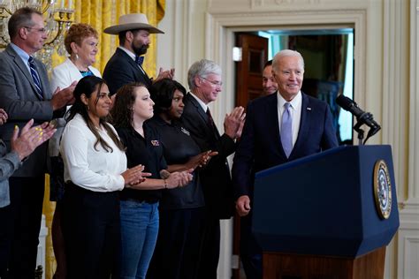Biden marks the 1-year anniversary of his signing of a major climate, health and tax law